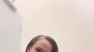 Naughty Nurse Squirts in Public Washroom