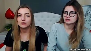 Two brunette amateur teen lesbian hotties stripping and tying in bed then licking in their private live webcam show on homemade footage