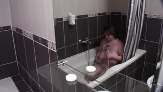 Sexy mama slow-blowing in bathroom