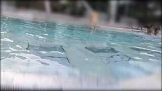 Teen fingers my pussy in a public pool in front