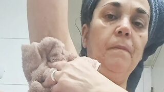 Milf shaves the few armpit hairs and some of the pubic hair on her hairy pussy