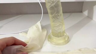 I give a handjob to the dildo with oily hands