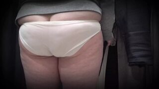 In a fitting room in a public store, the camera