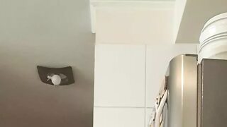 In the kitchen half-dressed