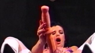 Gorgeous lesbian strips down and impales her pussy and ass